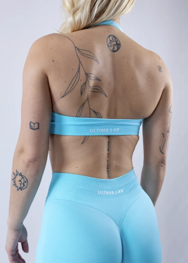 Športová podprsenka ULTIMA.LAB v tyrkysovej farbe – bezšvová dámska podprsenka na cvičenie, jogu a fitness, elastický priedušný materiál, moderný dizajn.